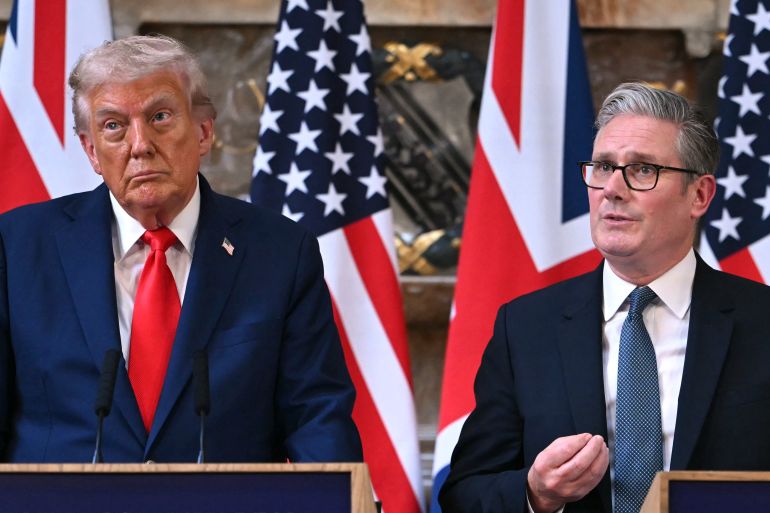 Britain's Prime Minister Keir Starmer (R) speaks as US President Donald Trump