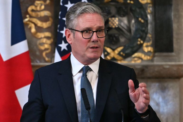 UK Prime Minister Keir Starmer gestures during a news conference.