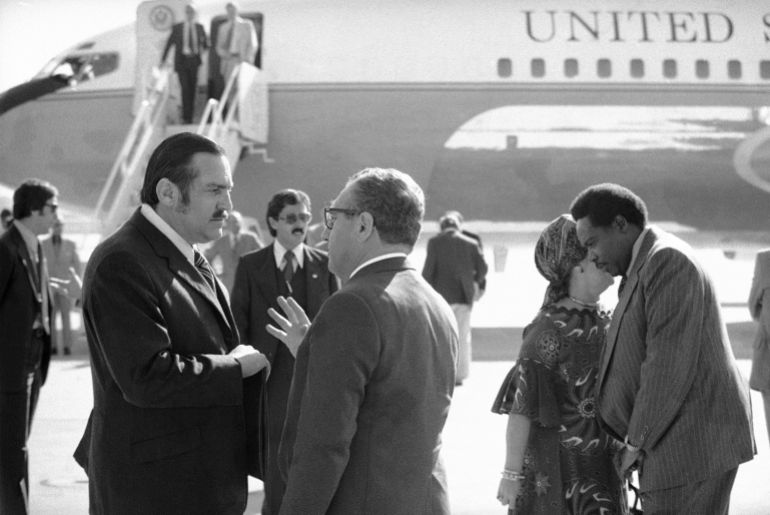 US Secretary of State Henry Kissinger chats with RF Botha, South African Ambassador to the United States at Andrews Air Force Base in Maryland, on September 13, 1976