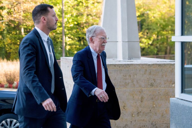 John Bolton, right, faces criminal charges for allegedly mishandling classified information