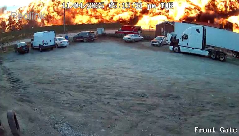 Smoke and flames rise as a UPS cargo plane crashes in Louisville, Kentucky