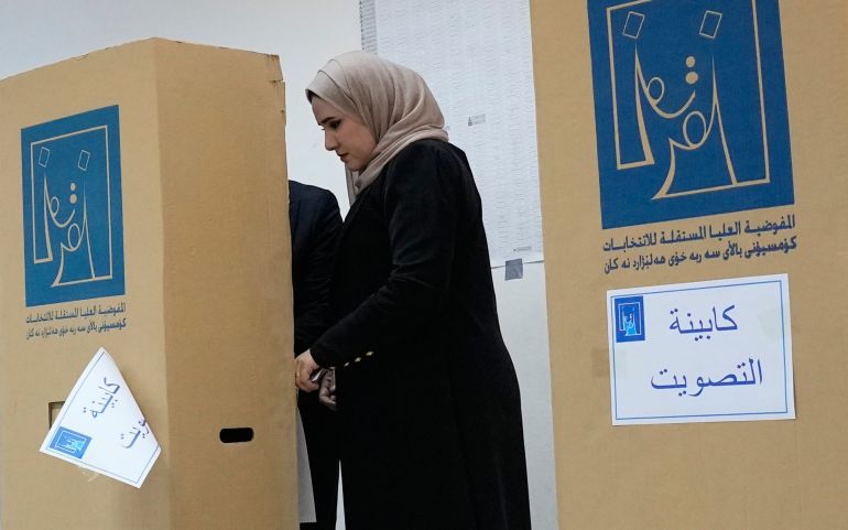 An Iraqi woman casts her vote during the parliamentary election at a polling centre in Baghdad, Iraq, November 11, 2025 [AP Photo]