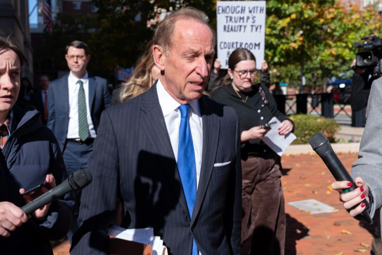 Former FBI Director James Comey’s lawyer Abbe Lowell talks to reporters as he leaves the federal court in Alexandria, Virginia, on November 13