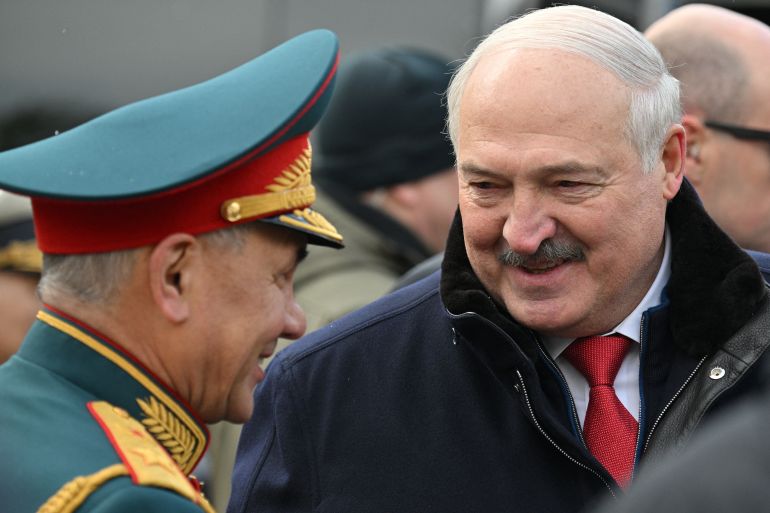 Belarusian President Alexander Lukashenko speaks with Russian Defence Minister Sergei Shoigu during a flower-laying ceremony at the Tomb of the Unknown Soldier on Victory Day, which marks the 79th anniversary of the victory over Nazi Germany in World War Two, in central Moscow, Russia, May 9, 2024. Sputnik/Ramil Sitdikov/Pool via REUTERS ATTENTION EDITORS - THIS IMAGE WAS PROVIDED BY A THIRD PARTY.