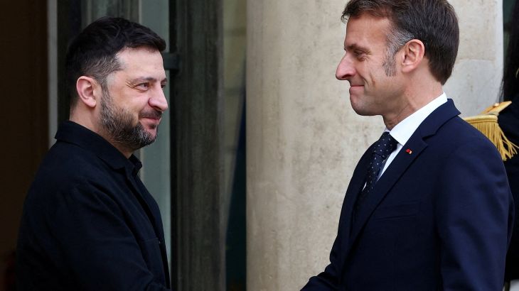 French President Emmanuel Macron welcomes Ukrainian President Volodymyr Zelenskiy as he arrives for a meeting at the Elysee Palace in Paris, France, December 1, 2025.