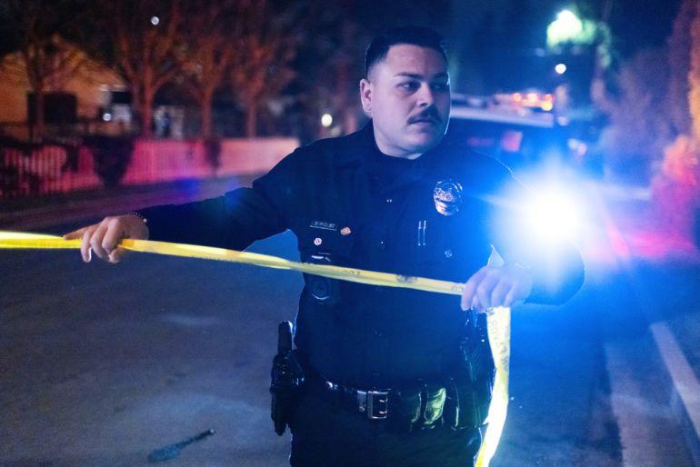 A police officer blocks off a street near Rob Reiner’s residence on December 14, 2025, in the Brentwood section of Los Angeles, California