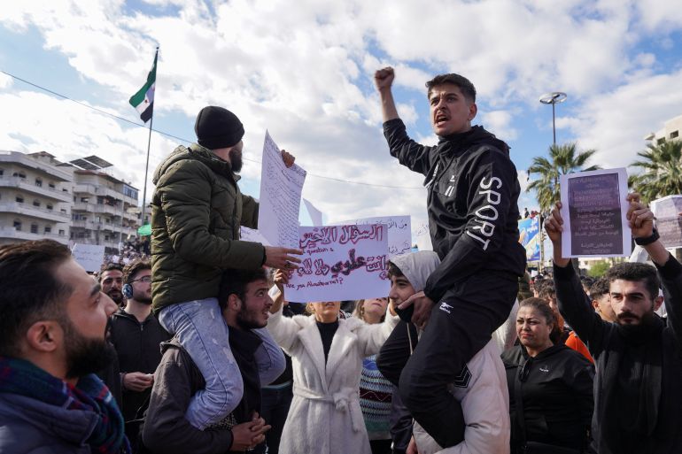 People from the Alawite sect protest as they demand federalism and an end to what they say is the killing and violations against Alawites, in Latakia, Syria, December 28, 2025. REUTERS/Karam al-Masri