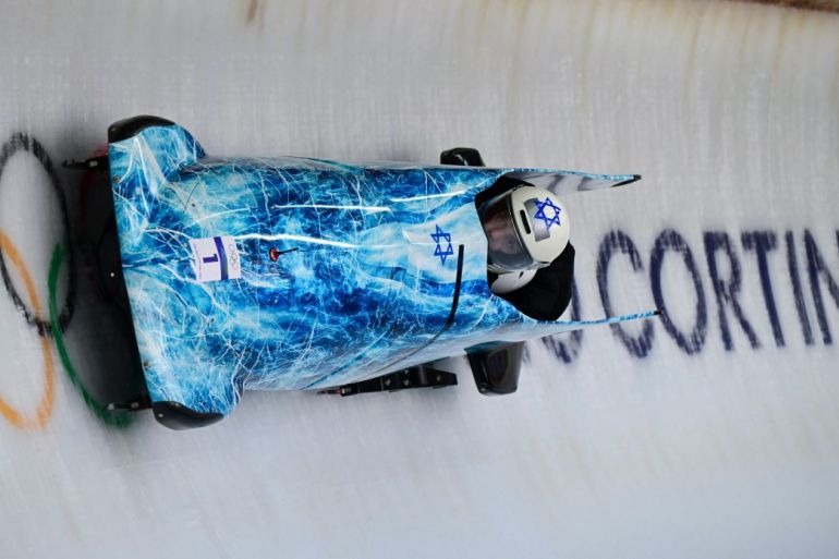 Israel's Adam Edelman pilots in the bobsleigh men's 2-man training.