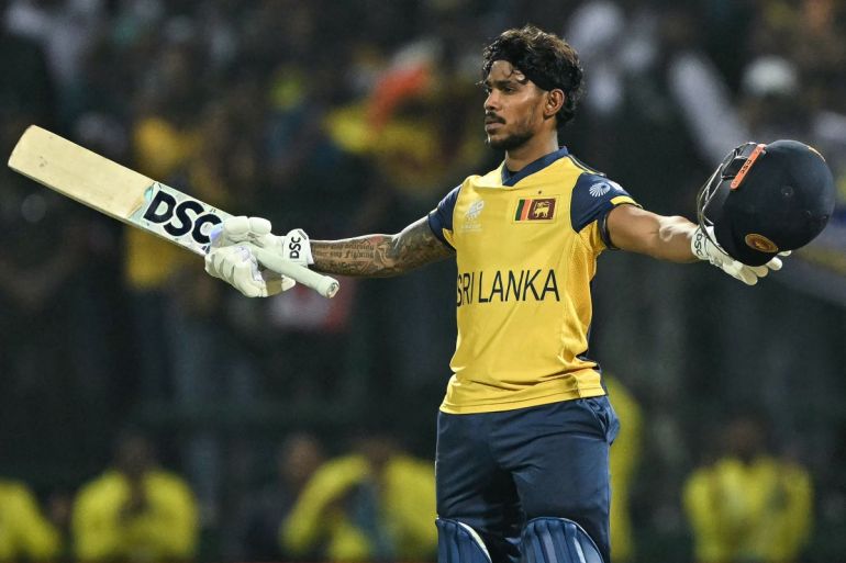 Sri Lanka's Pathum Nissanka celebrates after scoring a century (100 runs) during the 2026 ICC Men's T20 Cricket World Cup group stage match between Australia and Sri Lanka at Pallekele International Cricket Stadium in Kandy on February 16, 2026. (Photo by Ishara S. KODIKARA / AFP)