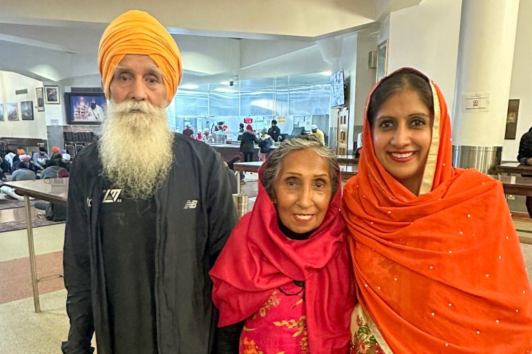 Minreet with her parents, Rajinder and Pritpal, at their gurdwara in October 2024. For her birthday, Minreet held a prayer at the temple in gratitude for her mum entering remission after six months of treatment [Courtesy of Minreet Kaur]