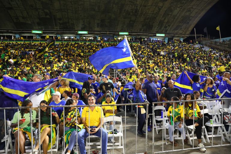 Soccer Football - FIFA World Cup - CONCACAF Qualifiers - Group B - Jamaica v Curacao - National Stadium Independence Park, Kingston, Jamaica - November 18, 2025 Curacao and Jamaica fans in the stands before the match REUTERS/Gilbert Bellamy