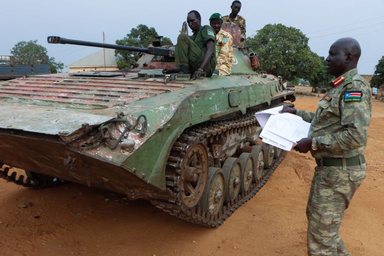 Major General Lul Ruai Koang the spokesperson for the South Sudan People's Defence Forces (SSPDF) shows journalists a captured BMP-2 infantry fighting vehicle nicknamed “Boorchar” seized by Sudan People's Liberation Movement-in-Opposition (SPLA-IO) fighters from an Indian peacekeeping unit serving under the United Nations Mission in South Sudan (UNMISS) during the 2013 conflict; after a press conference on the military operations in Akobo and ordering the withdrawal of UNMISS from the area; at the SSPDF armoury barracks in Juba, South Sudan March 6, 2026. REUTERS/Samir Bol