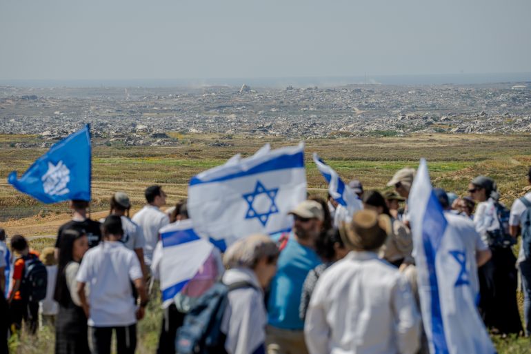 KIBBUTZ NIR AM, ISRAEL - APRIL 22: Right-wing Nachala movement settlers march near the Gaza border, advocating for the resettlement of the Gaza Strip, near Kibbutz Nir Am as Israelis observe Yom Ha'atzmaut, National Independence Day on April 22, 2026 near Kibbutz Nir Am, Israel. (Photo by Erik Marmor/Getty Images)