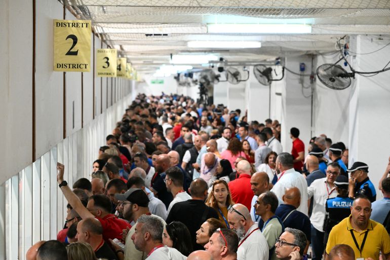 Representatives of the various parties and candidates monitor the regularity of the counting for Malta's legislative elections at the Electoral Commission Counting Complex, in Naxxar, on the island of Malta, on May 31, 2026.