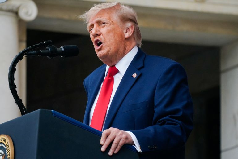 US President Donald Trump speaks at a lectern.