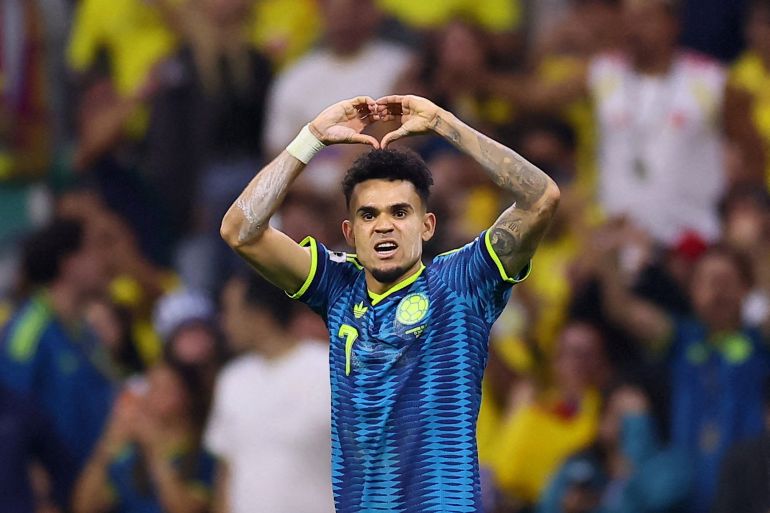 The Colombian winger celebrates on the pitch after scoring their second goal