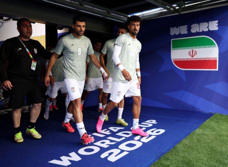 LOS ANGELES, CALIFORNIA - JUNE 15: Mehdi Taremi #9 and players of IR Iran walk out the tunnel for the warm up before the FIFA World Cup 2026 Group G match between IR Iran and New Zealand at Los Angeles Stadium on June 15, 2026 in Los Angeles, California. Richard Heathcote/Getty Images/AFP (Photo by Richard HEATHCOTE / GETTY IMAGES NORTH AMERICA / Getty Images via AFP)