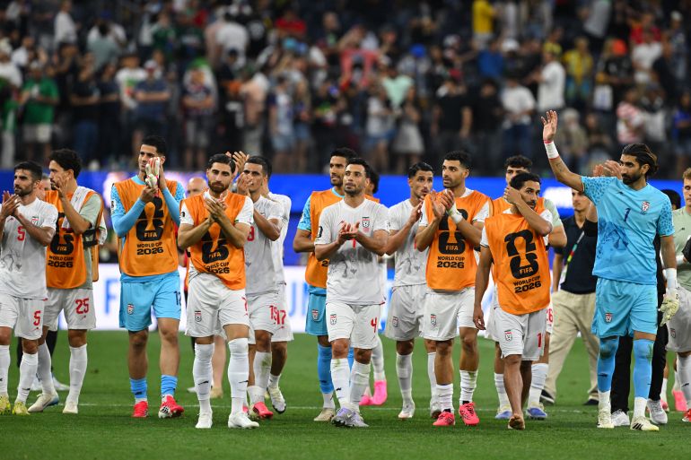 Iran's players greet supporters after the 2026 World Cup Group G football match between Iran and New Zealand at Los Angeles Stadium in Inglewood on June 15, 2026. (Photo by Patrick T. Fallon / AFP)