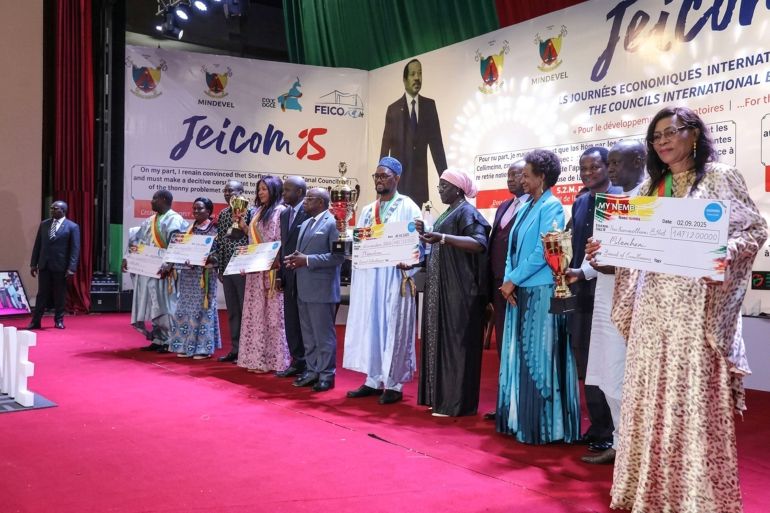 Mayors from Cameroon's top-performing municipalities, including Mayor Oumarou Sanda of Garoua 2 (center), are awarded for their exceptional efforts in deriving grassroots civil registration [Salomon Beguel _ UNICEF]