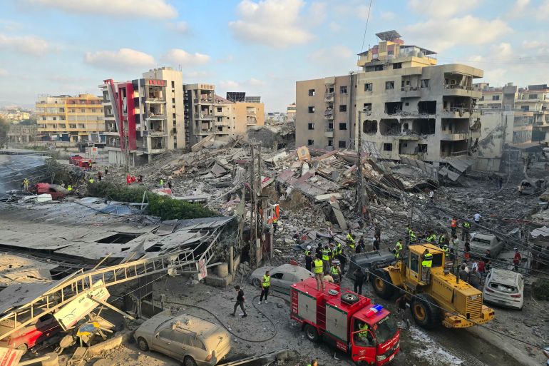 First responders gather at the site of an Israeli strike.