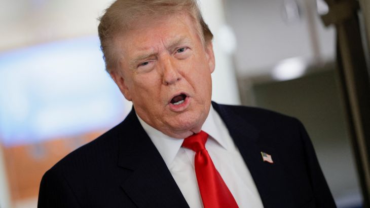 U.S. President Donald Trump speaks to reporters aboard Air Force One en route to Michigan, U.S., July 27, 2026. REUTERS/Evan Vucci