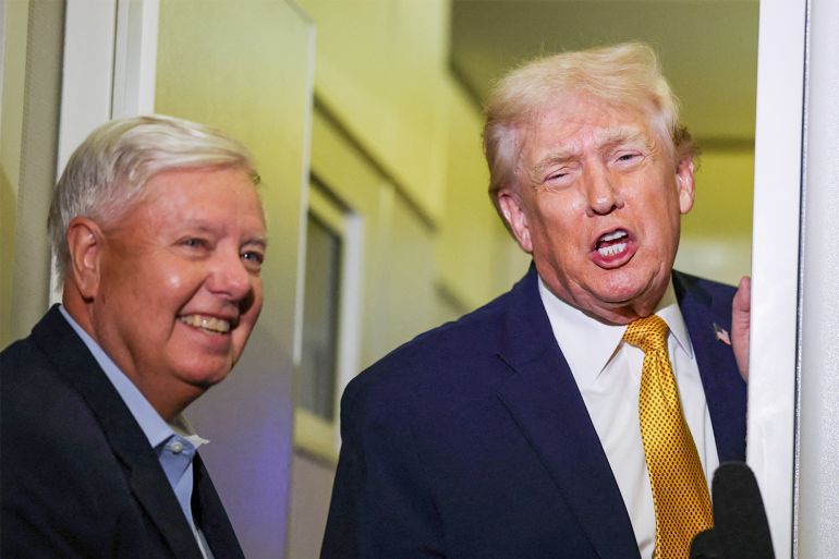 US President Donald Trump, right, and Senator Lindsey Graham speak to reporters on board Air Force One, January 4, 2026 [Joe Raedle/Getty Images via AFP]